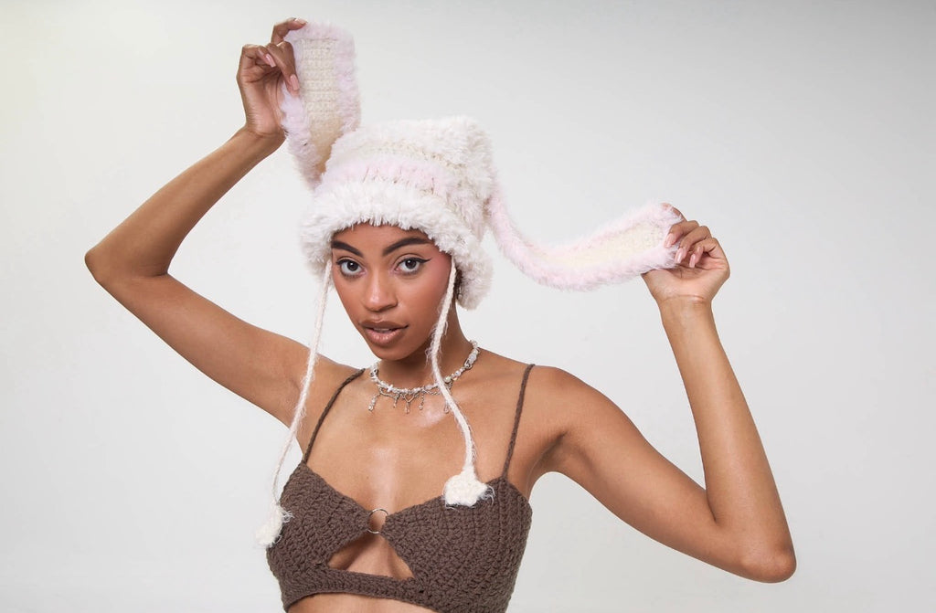 Model wearing the Angel Girl Star hat styled with a matching outfit on a white background