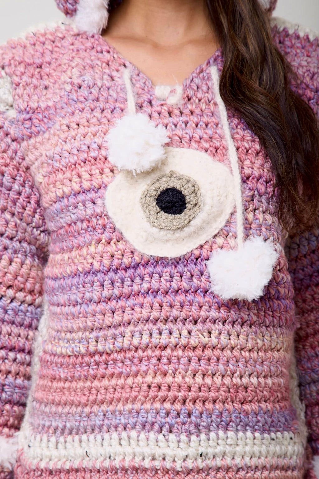 Close-up of fur pom pom and crochet texture on Cloud 9 hoodie