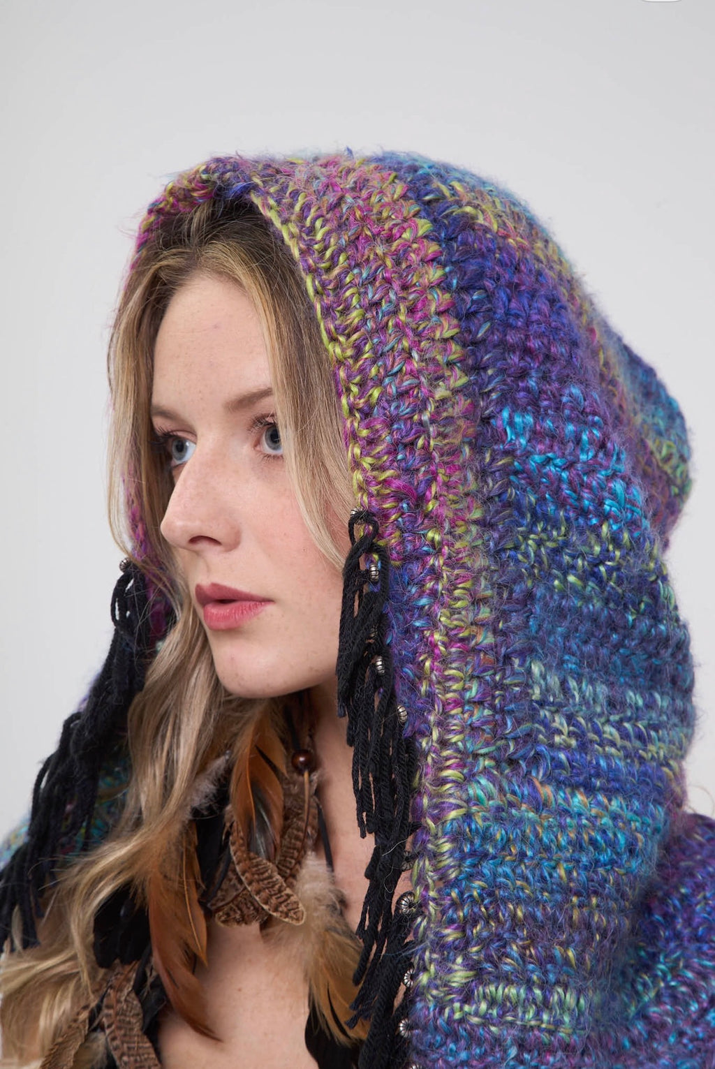 Close-up of the Metamorphosis hoodie showing the multicolor crochet hood detail