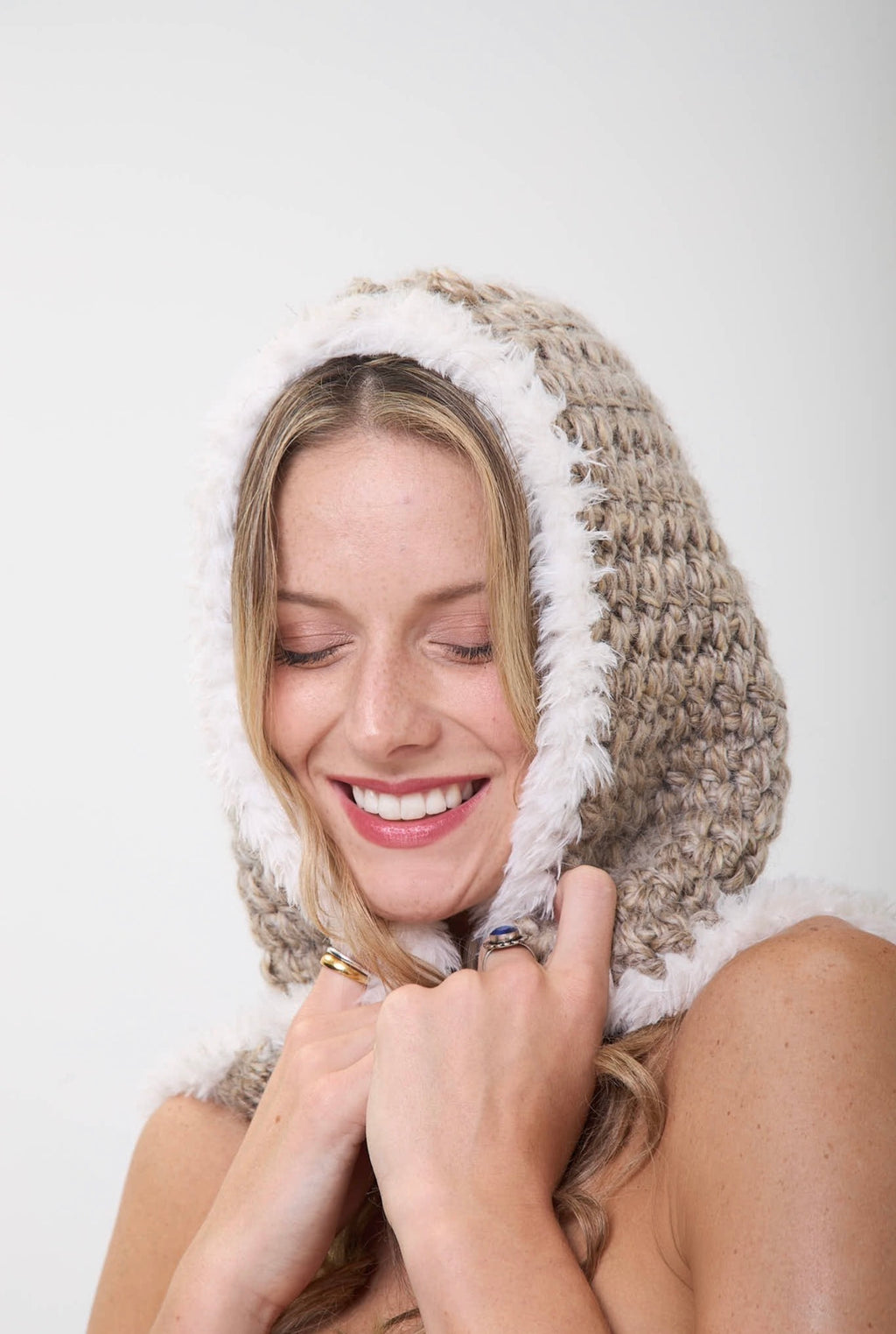 Handmade crochet hood with fur trim worn as sand storm headcovering