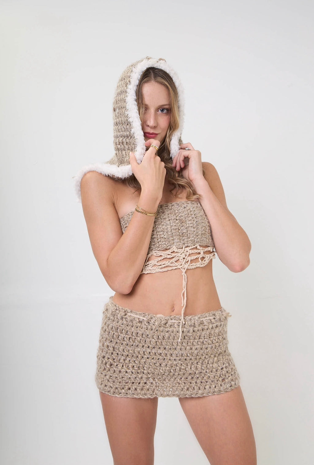Handmade crochet sand storm headcovering styled as part of a set