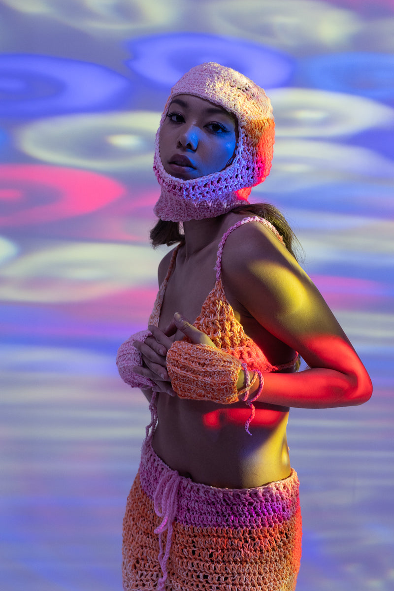 Sunset ombré crochet balaclava styled for rave and festival wear