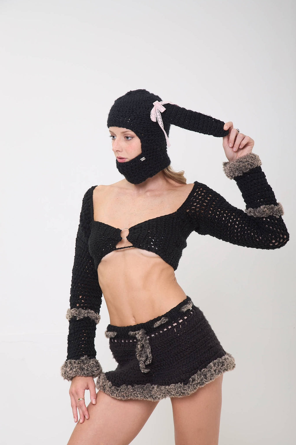 Model posing wearing the Sweetie Bunny balaclava shown from a different angle on a white background