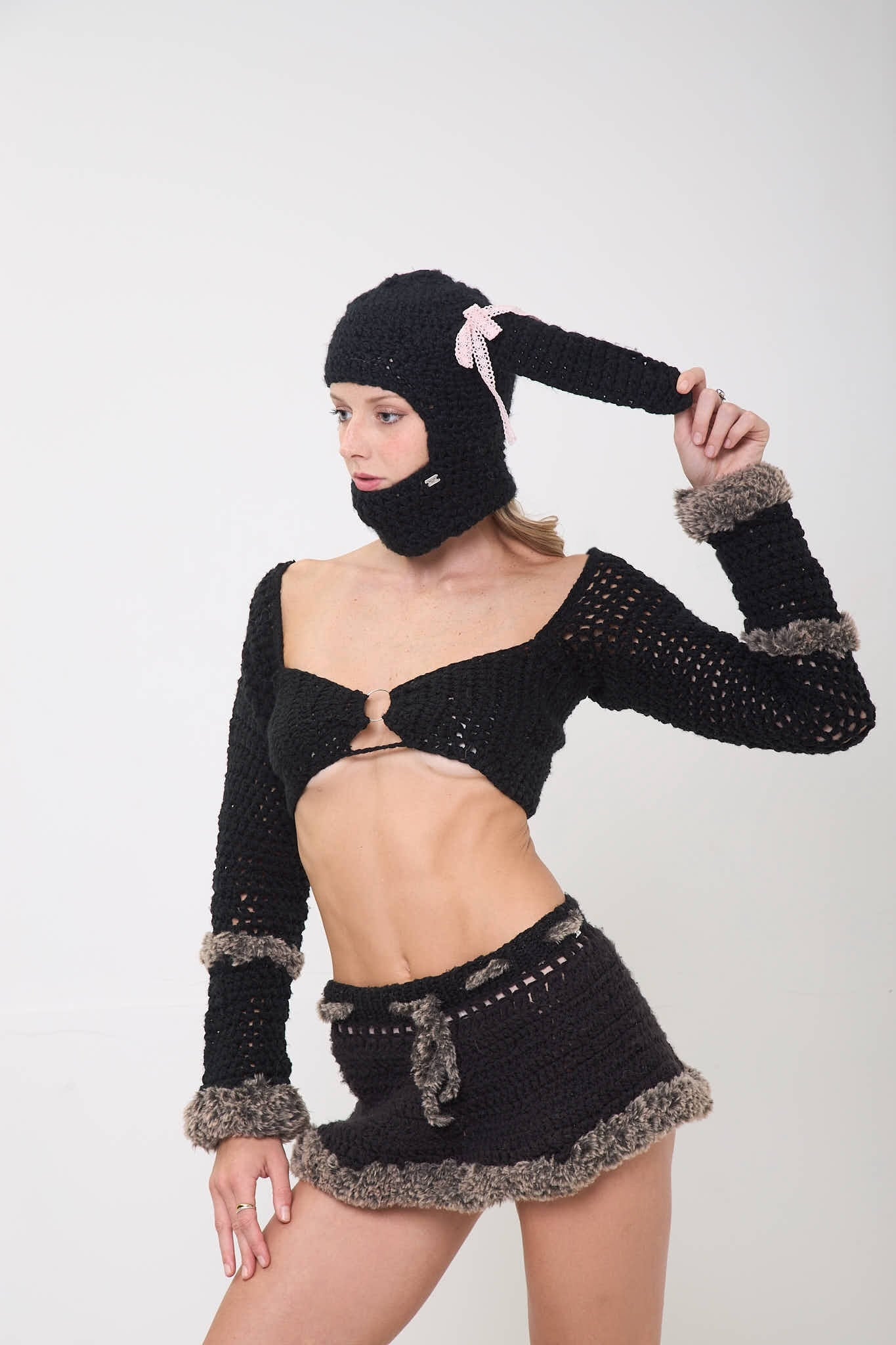 Model posing wearing the Sweetie Bunny balaclava shown from a different angle on a white background